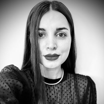 Black and white photo of young brunette woman